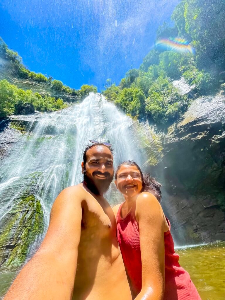 A Couple in front of the waterfall