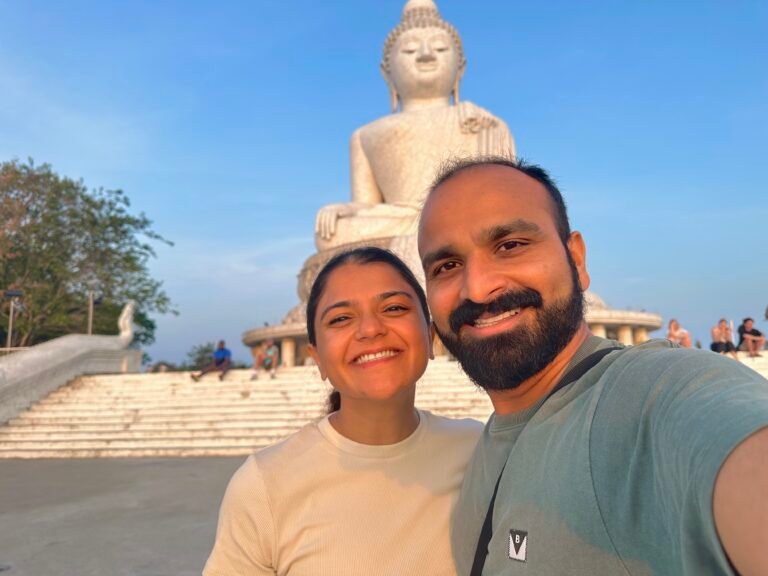 A couple in front of the Big Buddha in Phuket