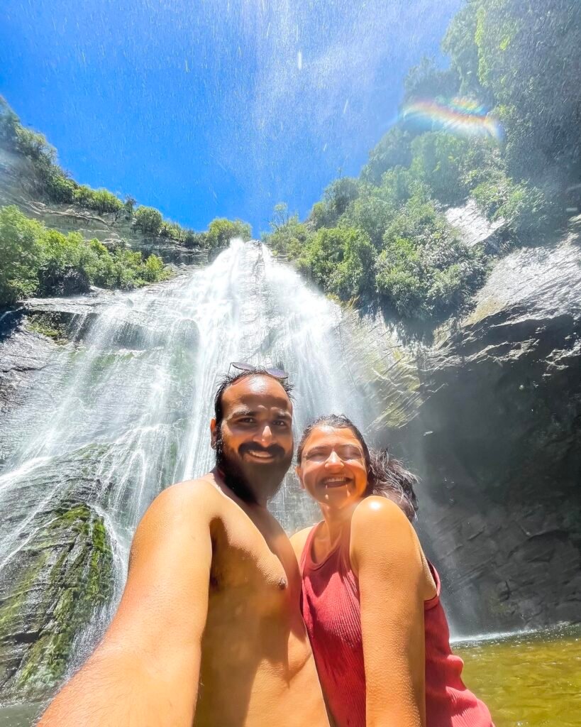 A Couple in front of the Shine Waterfall New Zealand