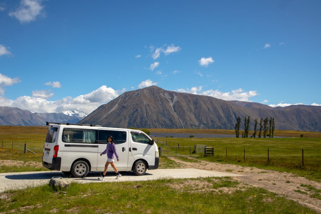 Campervan parked in an open field in the South Island, New Zealand