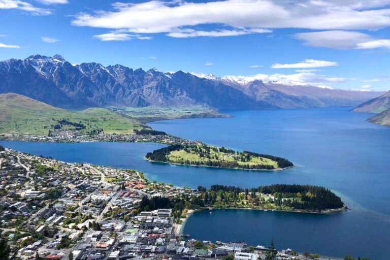 Aerial view of Queenstown, New Zealand, showing Lake Wakatipu, the Remarkables mountain range, and the town below — a helpful overview for anyone researching where to stay in Queenstown