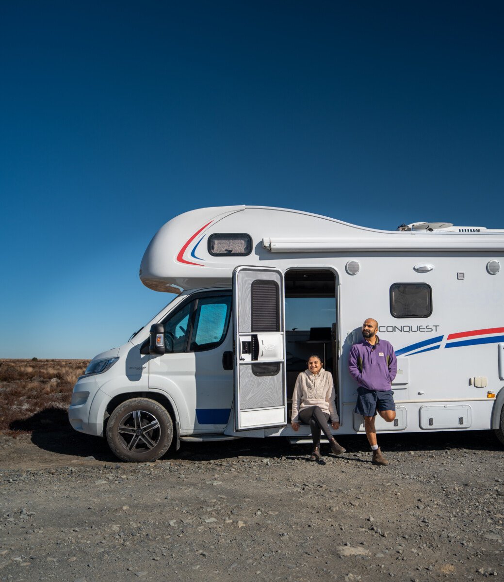 A couple in front of the Motorhome 