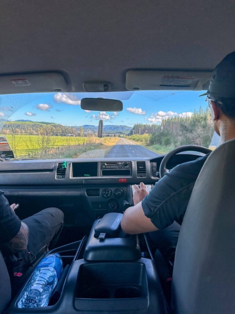 View from inside the 4WD vehicle driving up the steep private access road to Mount Tarawera trailhead, Rotorua New Zealand