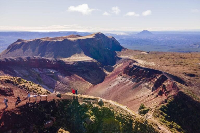 Wide aerial view of the vivid red Mount Tarawera hike volcanic crater landscape on Mount Tarawera, Rotorua New Zealand
