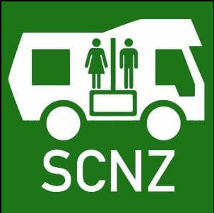 Green SCNZ self-containment certification logo showing a campervan with two people and a toilet symbol