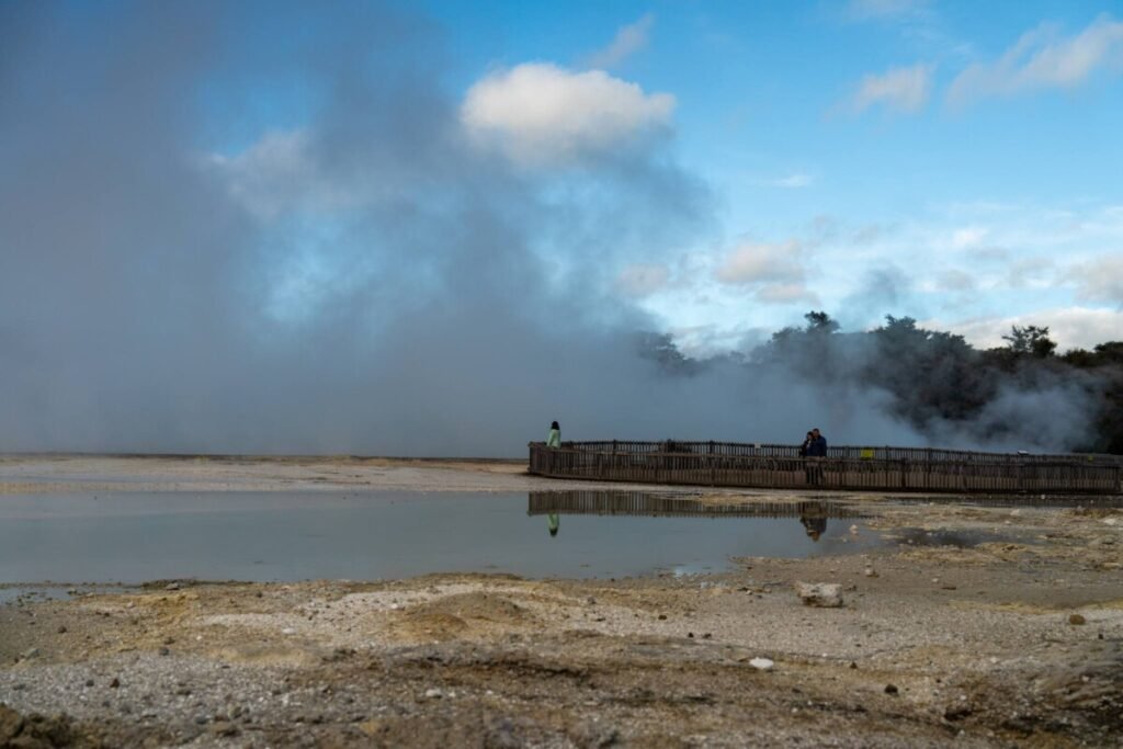 Vivid coloured geothermal pools and steaming craters at Wai-O-Tapu geothermal wonderland near Rotorua